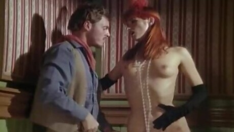 Eva Falk the horny redhead babe gives a blowjob to cowboy