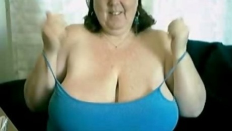 Solo with a fat granny playing with her huge tits and meaty cunt