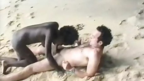 Sexy French ebony gets her tits sprayed on the beach