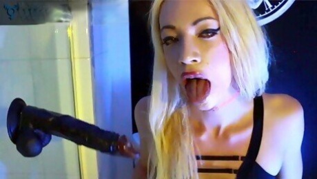 Shemale Sasha De Sade peeing then deepthroating dildos